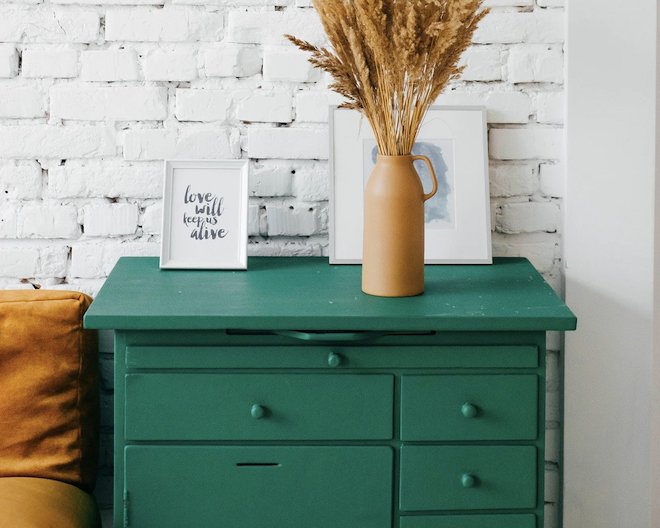 a green drawer with objects